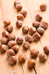 Image showing hazelnuts on wooden table