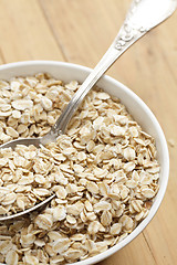 Image showing oatmeal on wooden table
