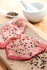 Image showing raw beef steak with pepper