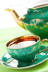 Image showing tea in antique porcelain mug