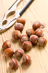 Image showing hazelnuts on wooden table