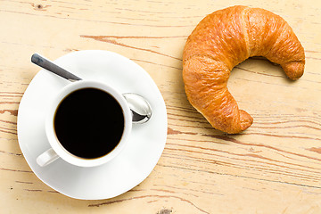 Image showing fresh croissant with coffee