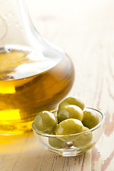 Image showing green olives and oil