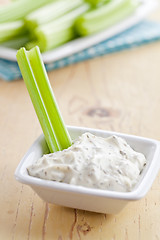 Image showing green celery sticks with tasty dip