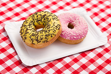 Image showing sweet doughnuts on paper plate