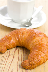 Image showing fresh croissant with coffee