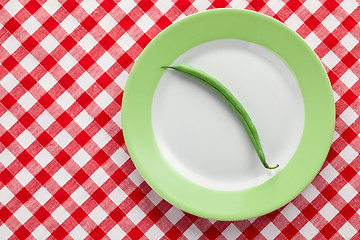 Image showing green bean pod on plate