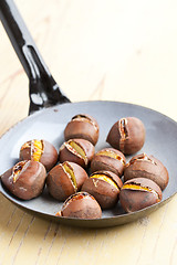 Image showing roasted chestnuts on pan
