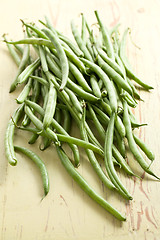 Image showing bean pods on wooden table