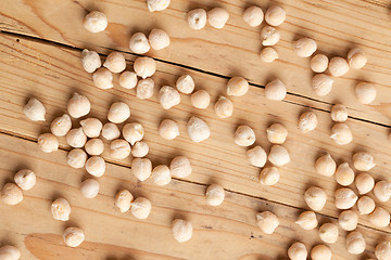 Image showing chickpeas on wooden table