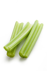 Image showing green celery sticks on white background