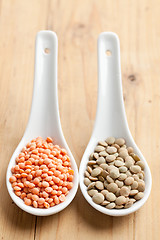 Image showing red and brown lentils in porcelain spoon