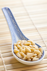 Image showing pine nuts in ceramic spoon