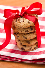 Image showing chocolate cookies with red ribbon