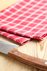 Image showing checkered napkin and knife