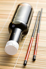 Image showing soy sauce and chopsticks