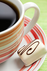 Image showing chocolate praline and coffee cup