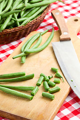 Image showing bean pods with knife