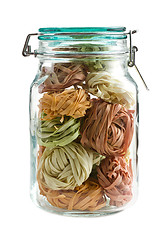 Image showing colorful pasta tagliatelle in glass jar