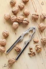 Image showing nutcracker and walnuts