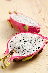 Image showing pink pitahaya on wooden table