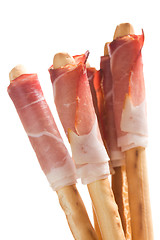 Image showing grissini sticks with ham