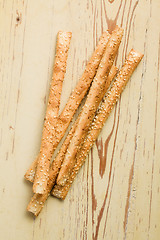 Image showing grissini sticks with sesame seeds