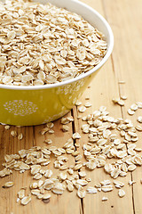 Image showing oatmeal on wooden table