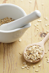 Image showing oatmeal on wooden table