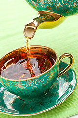 Image showing tea in antique porcelain mug