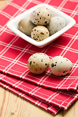 Image showing quail eggs on kitchen table