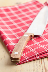 Image showing checkered napkin and knife