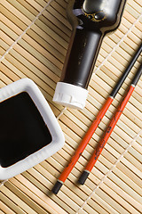 Image showing soy sauce and chopsticks