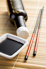 Image showing soy sauce and chopsticks