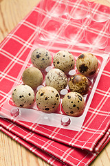 Image showing quail eggs on kitchen table