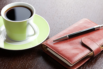 Image showing pen on diary and coffee mug