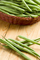 Image showing bean pods on wooden table