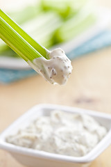 Image showing green celery sticks with tasty dip