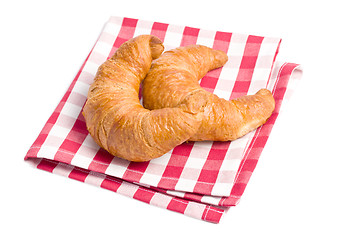 Image showing fresh croissants on checkered napkin