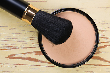 Image showing makeup brush and cosmetic powder compact 