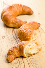 Image showing fresh croissant on wooden table