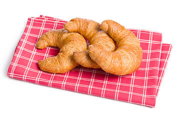 Image showing fresh croissants on checkered napkin