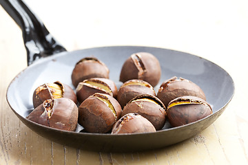 Image showing roasted chestnuts on pan