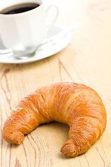 Image showing fresh croissant on wooden table