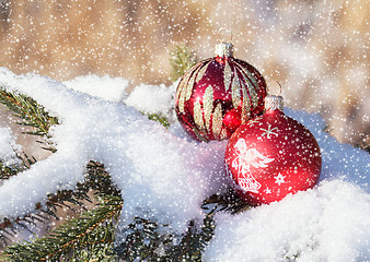 Image showing christmas balls on snowy day outdoor