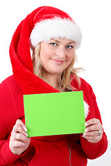 Image showing joyful pretty santa woman with empty sign