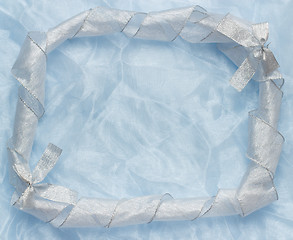 Image showing Christmas background with blue ornament and curled ribbon