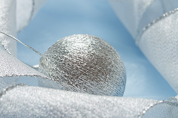 Image showing Christmas background with blue ornament and curled ribbon