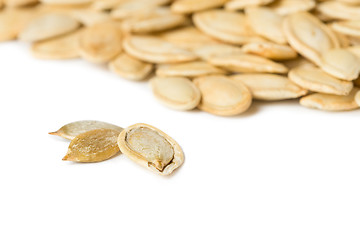 Image showing Pumpkin seeds isolated on the white background