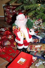 Image showing Santa Claus standing together with Christmas presents